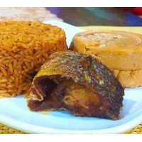 Jollof rice with moi-moi & croaker